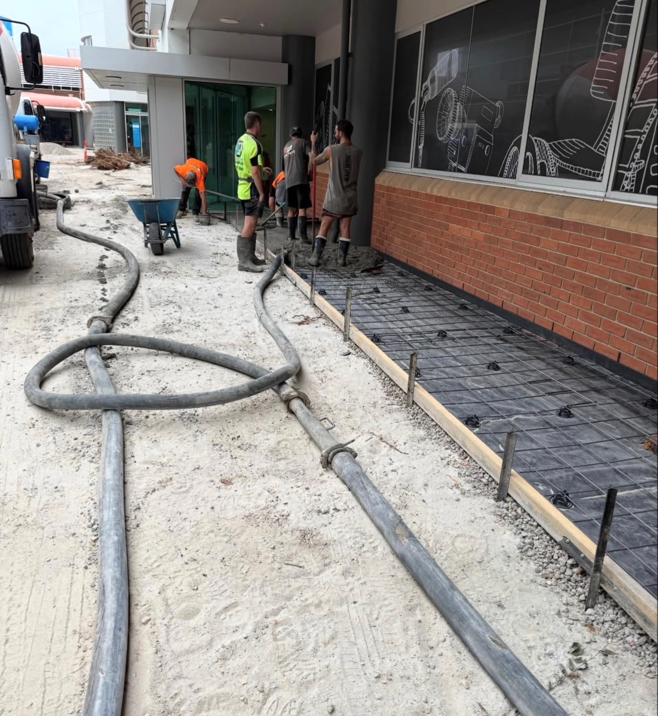Commercial concrete pumping lines on site